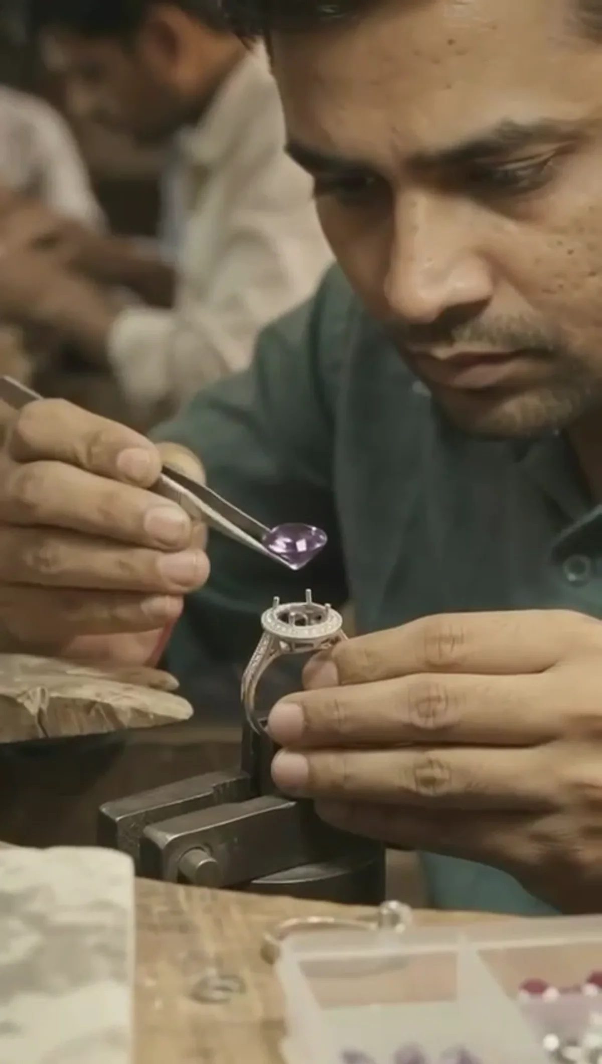 Hand finishing a silver jewellery piece