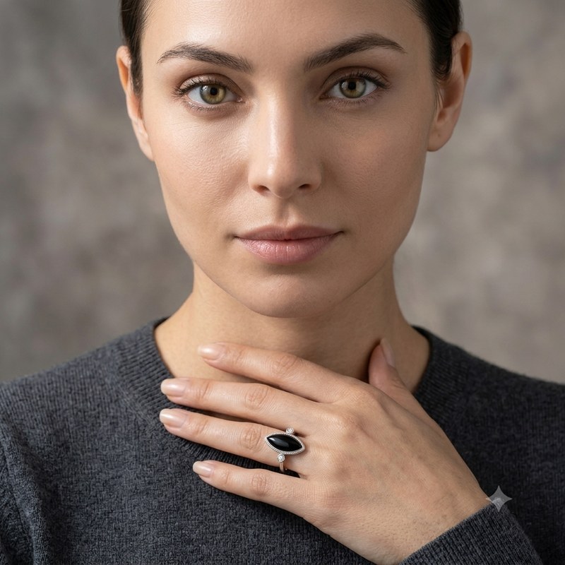 A woman wearing a marquise black onyx ring in 925 sterling silver